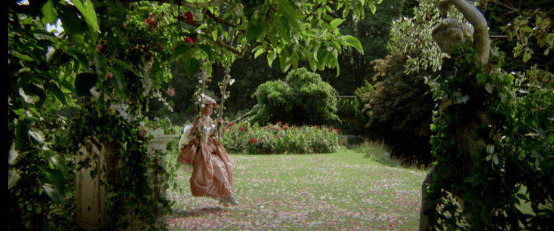 Cinderella wears a pink dress, swinging in a lush garden